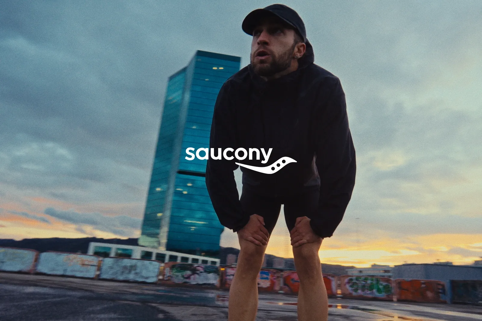 Runner catching breath on a Zurich rooftop at dawn